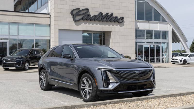 Cadillac LYRIQ EV Electric Vehicle display at a dealership. Cadillac offers the LYRIQ in Tech, Luxury and Sport models.