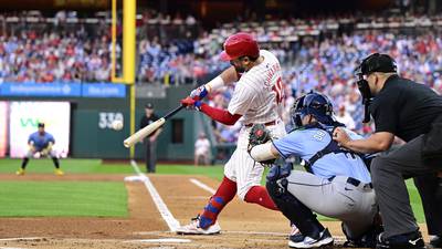 Phils' Schwarber sets MLB mark with 14th leadoff HR of the season before leaving with elbow injury